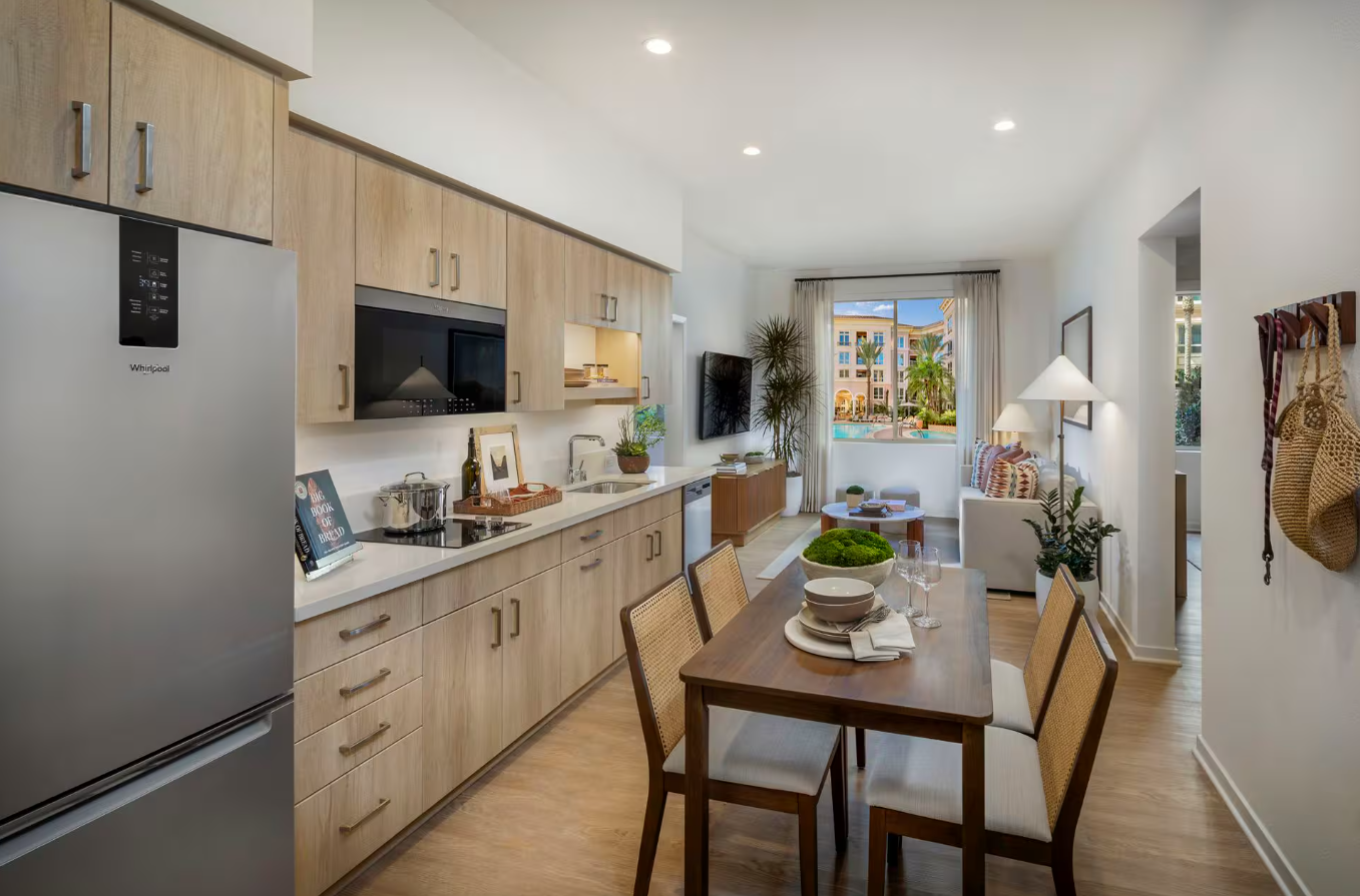 Interior of a Pacifica Place apartment unit, with a Cambium X7-35X Wi-Fi 7 access point ceiling-mounted above the kitchen and living area