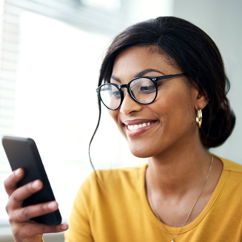 Image of a woman using her smartphone